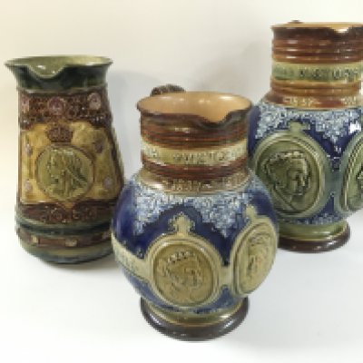 Three Queen Victoria royal Doulton jugs.