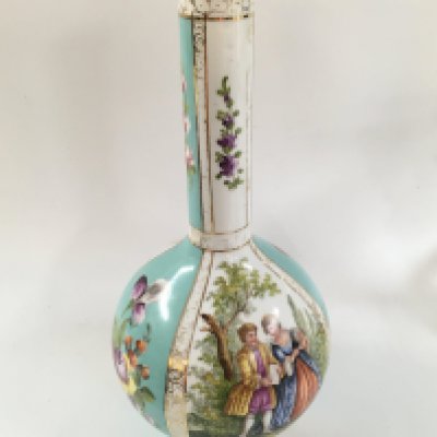 A Dresden bottle vase with floral patterns and gold features. Approx height 32 cm.