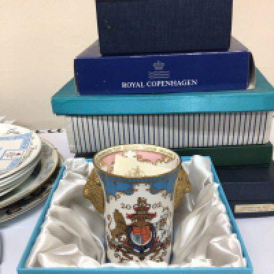 A box containing Boxed Royal Copenhagen collectors plates Buckingham Palace limited edition Beaker 2002 in a fitted box Wedgwood collectors plates and loose unboxed plates