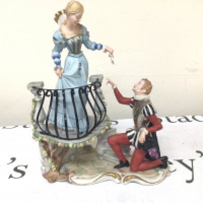 A Bisque porcelain figure group a girl on a balcony. The proposal. Hight 29cm