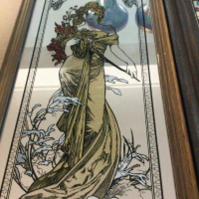 Four small framed mirrors with Art Nouveau design.