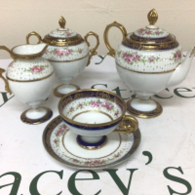A Noritaki porcelain Bachelor tea set decorated with flowers and applied gilt no obvious damage.