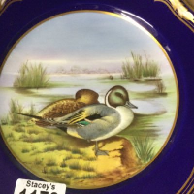 A collection of six Spode hand painted plates decorated with various birds .