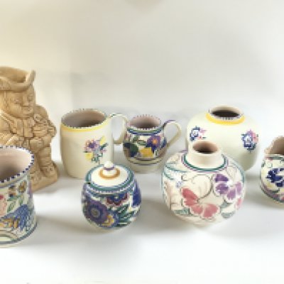 Poole pottery vases and jugs and an Arthur Wood toby jug . This lot cannot be posted
