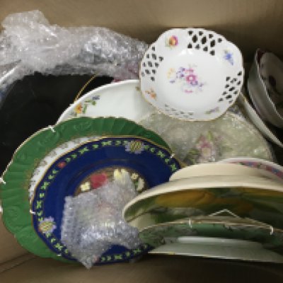 A box of ceramics comprising plates, vases etc. Shipping category D.