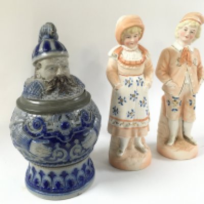 A German stoneware cobalt blue character stein and pair of German classical figures . Approximately 21cm tall.