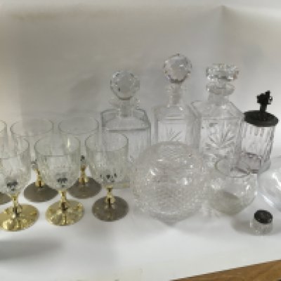 A collection of ceramics including green Wedgwood , cut glass decanters and glasses, vases, Springtime plates, botanic garden, Guernsey pottery dish , silver lidded condiment bottle etc.