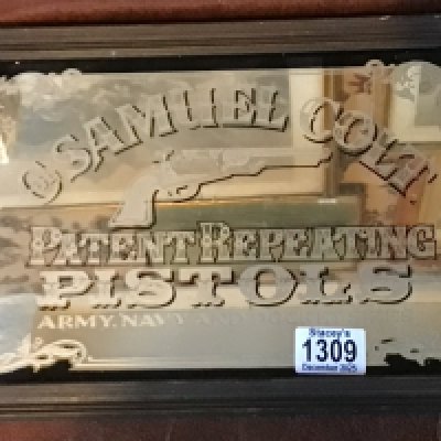 A 20th century advertisement mirror Samuel Colt Pistols.