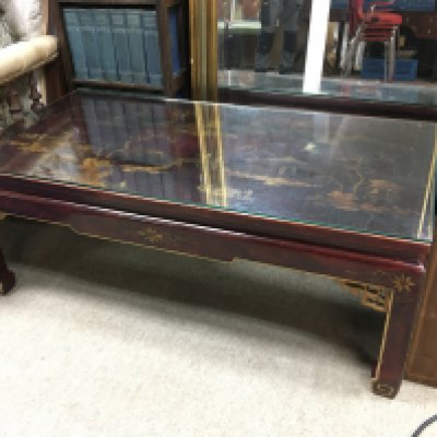 A low coffee table with a chinoiserie top, approx length 100cm. Shipping category D.- NO RESERVE