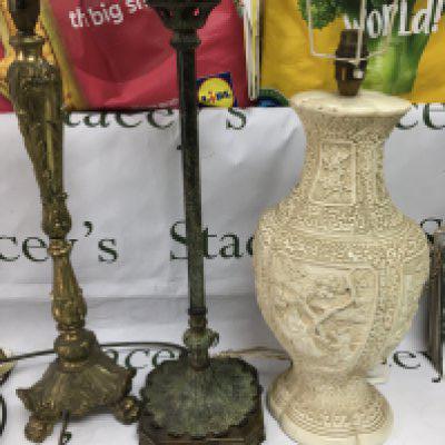 Three table lamps comprising a gilded example and two others. Shipping category D.