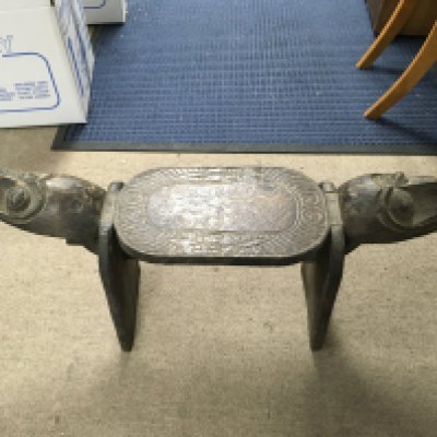 A hand carved African stool. Length 90cm, height 43cm.- NO RESERVE