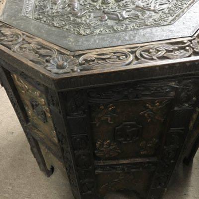 A Anglo Indian folding table with copper tray above a carved stand inset With copper panels. 70cm wide 66 high.
