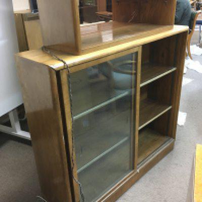 An Art Deco cabinet with peach glass mirrored back top shelf, aporox 110cm x 30cm x 130cm. Shipping category D.