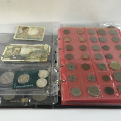 A red album containing mixed Victorian crown coinage as well as euro and other examples.