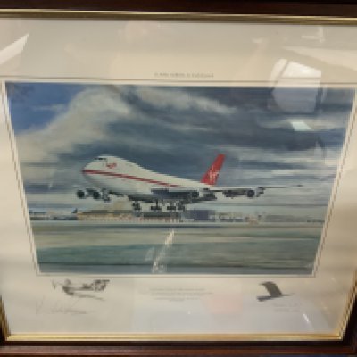 A Framed Virgin airways print celebrating 10 Years of Virgin Airways signed in pencil by Richard Branson and Sir Freddie Laker. 64cm x 48cm.
