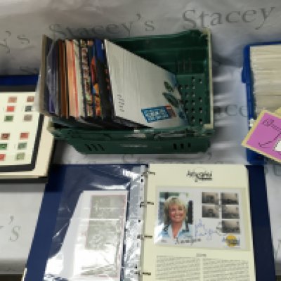 A box of Royal Mail year books with stamps along with stamp album signed covers etc