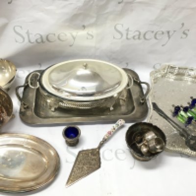 A Collection of silver plated items including Dishes, Cups, Cutlery , Galleon jug, unusual coloured glass handled cheese knives , a silver hallmarked handled pie server,two silver copies of a traditional religious icons George slaying the dragon and virgin Mary. This lot cannot be posted- NO RESERVE