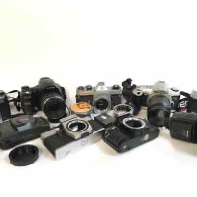 A Collection of vintage cameras including Asahi Pentax, Fujifilm, Canon EOS 500N, Olympus etc