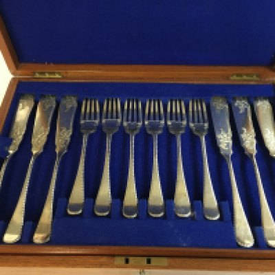 A two tier fish knives and forks cutlery set . Postage category B
