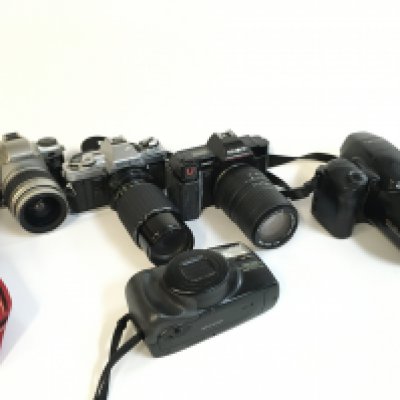 Five vintage cameras including Olympus, Minolta, Pentax etc . Postage category C