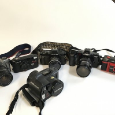 A Collection of vintage cameras including Hanimex, Minolta, Pentax, Canon, Olympus . Postage category C