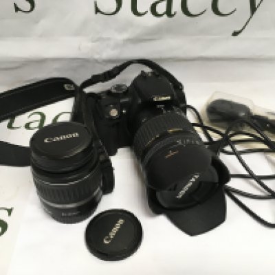 A Canon EO5 camera with two lenses and accessories. Shipping category D.