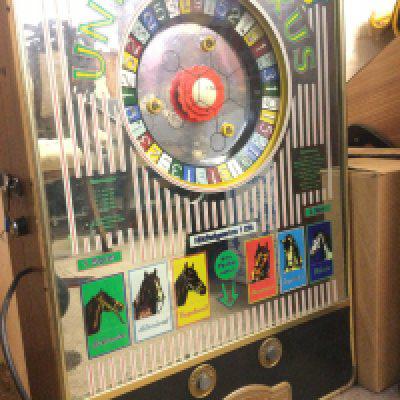 A German Wall Mounted Union-Luxus Gaming Machine by Bergmann And Co. Approx Height 73Cm.