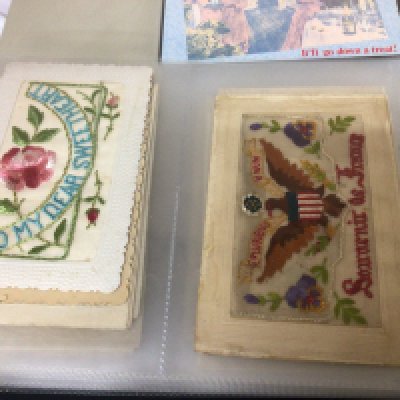 Three Albums containing a good collection of mixed postcards including a collection of I world war embroidered cards. Vintage Comical cards other late Victorian and early 20th century cards and 20th century political comical cards (3)