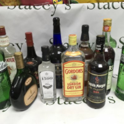 Twelve bottles of spirits comprising Gordon's Gin, Southern Comfort, Captain Morgan Rum etc. Shipping category D.