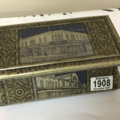 A Vintage biscuit tin depicting The Co-operative Society 1934 Vulcan Lane and Oxford Street Workington.