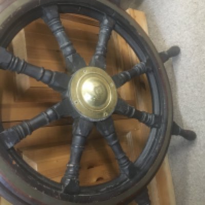 A ship&#2013265924&#2013266171s wheel with brass central inset .
