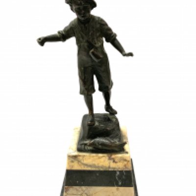 A small bronze figure of a fisher boy mounted on a marble base. 27cm.- NO RESERVE