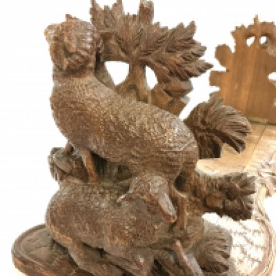 A good quality Blackforest carved extending book stand, each end carved with Rams and Ewes.