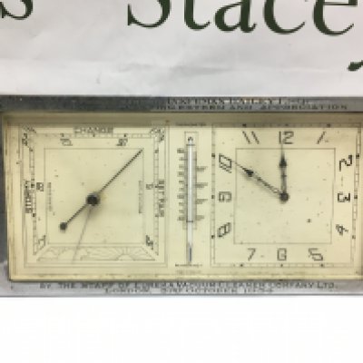 A 1930s desk clock and barometer with inscription. Shipping category D.