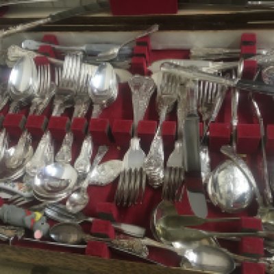 A oak case containing cutlery various .