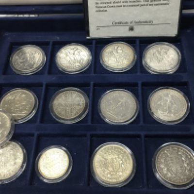 A collective lot of coins including two trade one dollar coins 1821 1891 1896 crowns etc. Postage B