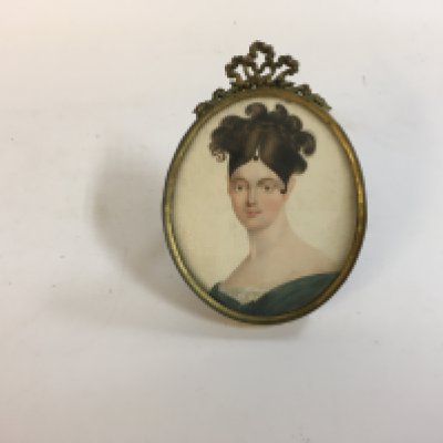 An oval portrait miniature of a lady circa 1790-1800