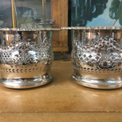 A pair of silver plated wine coasters 12 cm .
