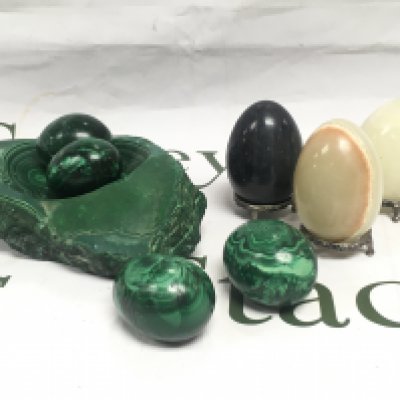 A small collection of green onyx and marble eggs. Shipping category B.