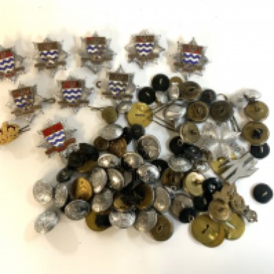 A mixed collection of vintage badges and buttons to include London Fire Brigade badges.