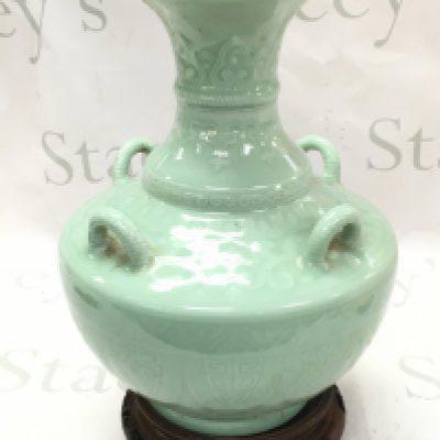 A Chinese Celadon glazed vase , with blue six character mark to base. 31cm tall . This lot cannot be posted