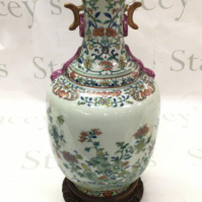 A Chinese porcelain celadon-glazed baluster vase with intricate designs of flowers, foliage, and birds. Blue six character mark to base. 34.5cm tall approximately. This lot cannot be posted