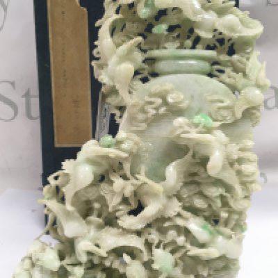 An impressive 20th century Apple Green dye Jade lidded pot surrounded by cranes and other animals, with box. Approximately 25cm tall 16cm wide . This lot cannot be posted