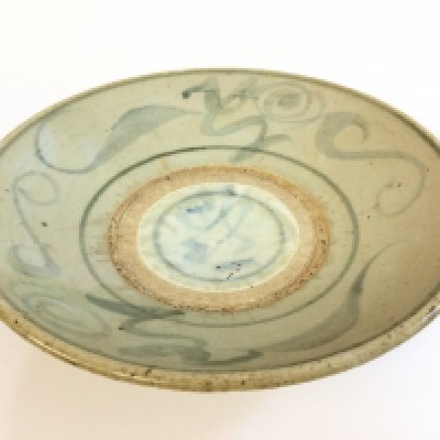 A large Chinese blue and white ming porcelain charger, approximately 27cm wide.
