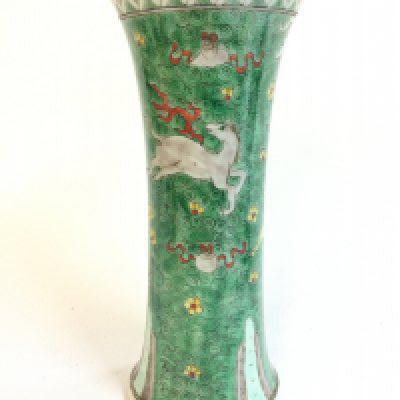 A Famille Verte Chinese vase decorated with small yellow and red flowers, depictions of a prancing horse with red ribbons. 22cm tall .No obvious large damage or restoration