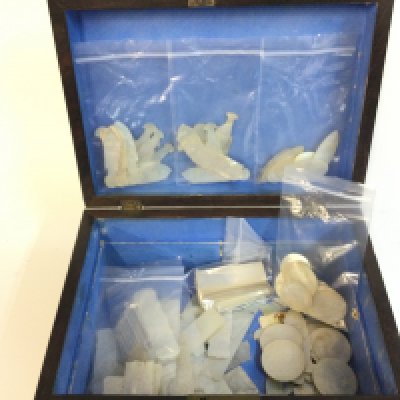 Approximately 90 Chinese mother of pearl gaming counters in an antique box . Postage category B