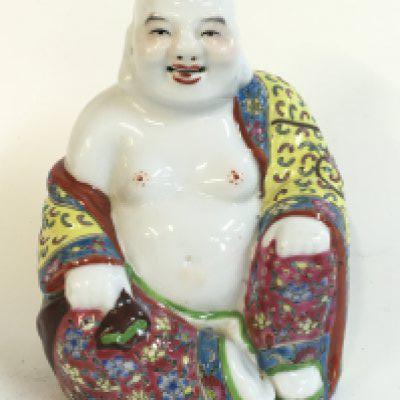 A Chinese porcelain Buddha , 17cm tall.