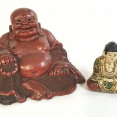 A Chinese 19th century porcelain Buddha and red cinnabar carved Buddha .