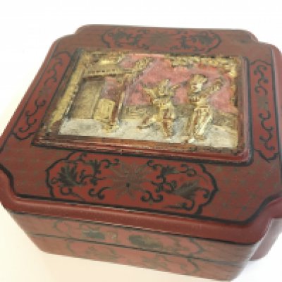 A large Chinese red cinnabar box. 9cm tall 24cm wide . Postage catC