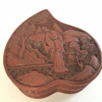 A Chinese red cinnabar box , 10cm wide , 5cm tall. Postage category A